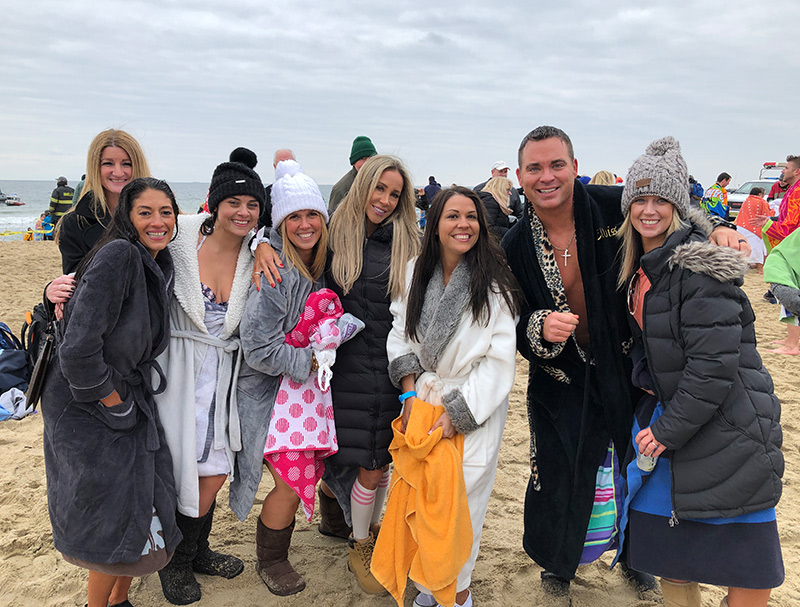 Volunteers at a polar plunge on the beach