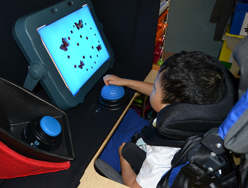 Boy using assistive technology